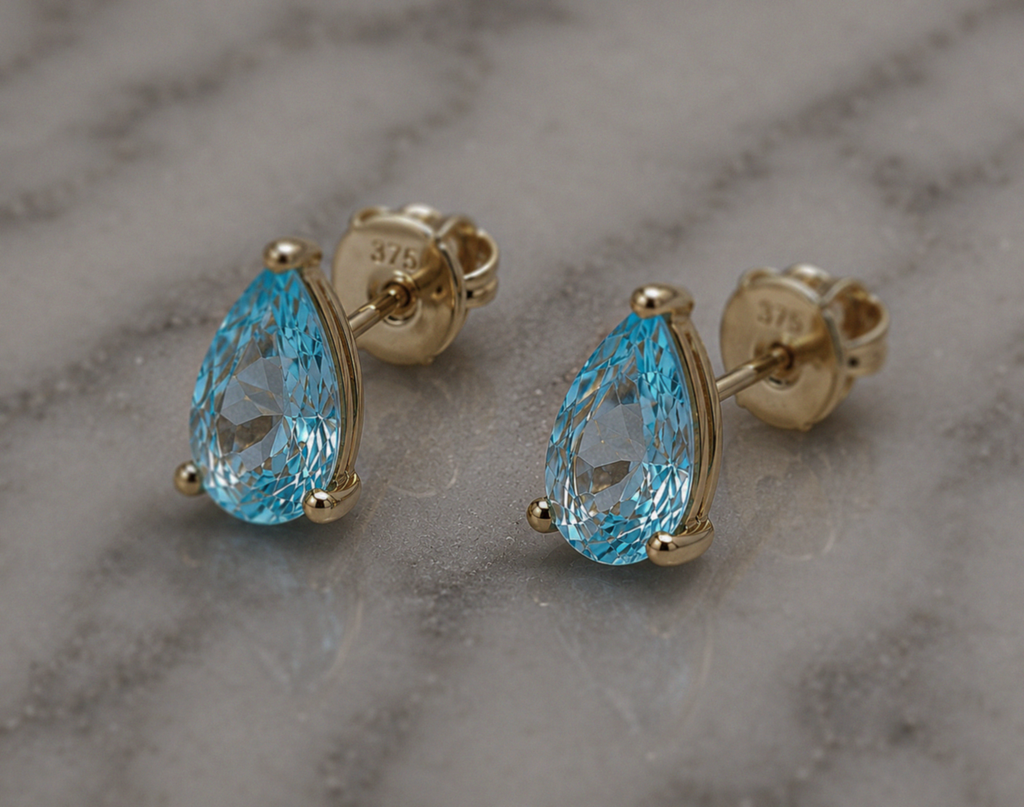 9ct Yellow Gold Pear Cut Blue Topaz Stud Earrings