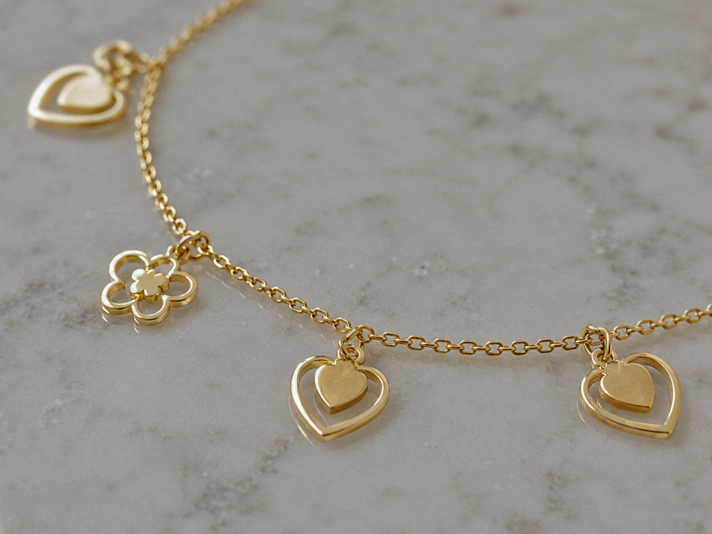 9ct Gold Heart & Flower Charm Bracelet - Delicate Charm Bracelet in Yellow Gold.