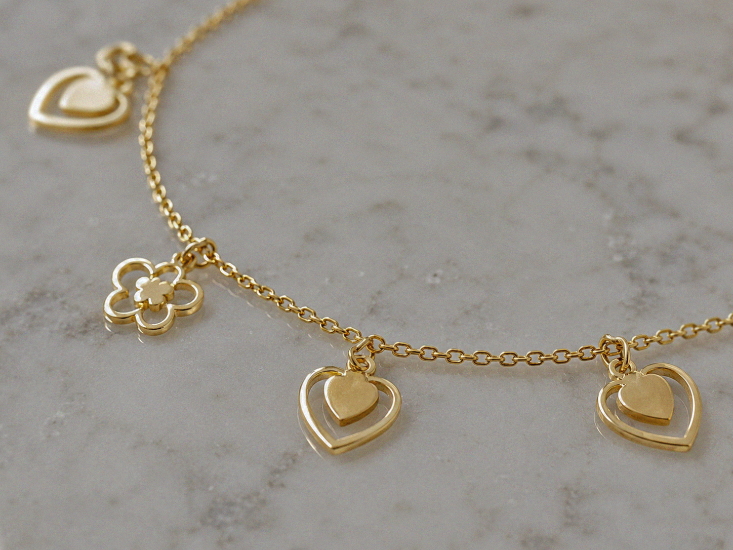 9ct Gold Heart & Flower Charm Bracelet - Delicate Charm Bracelet in Yellow Gold.