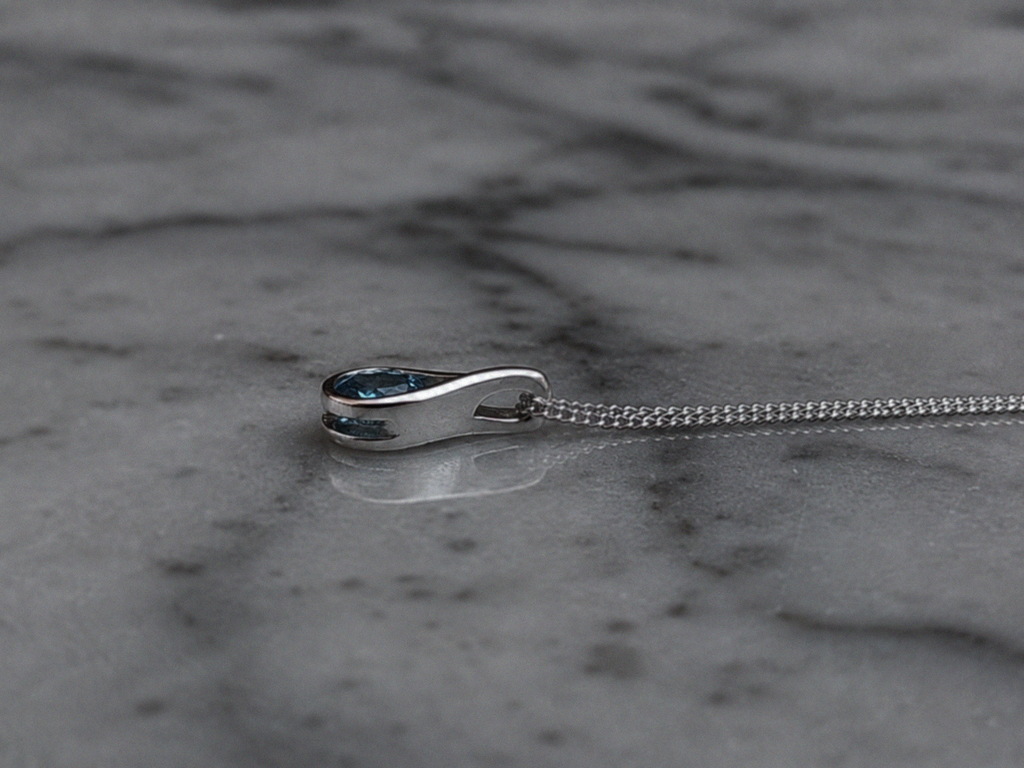 Sterling Silver Blue Topaz Teardrop Pendant Necklace