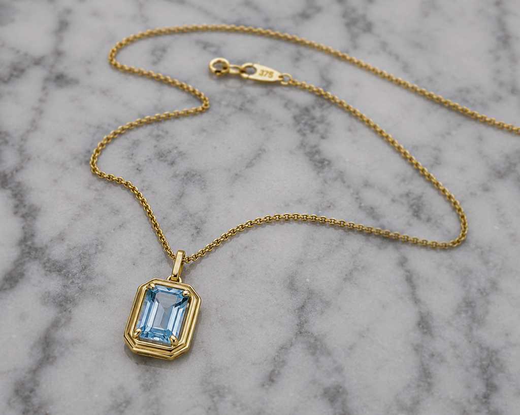 Elongated Aquamarine Pendant in 9ct Gold Curb Chain