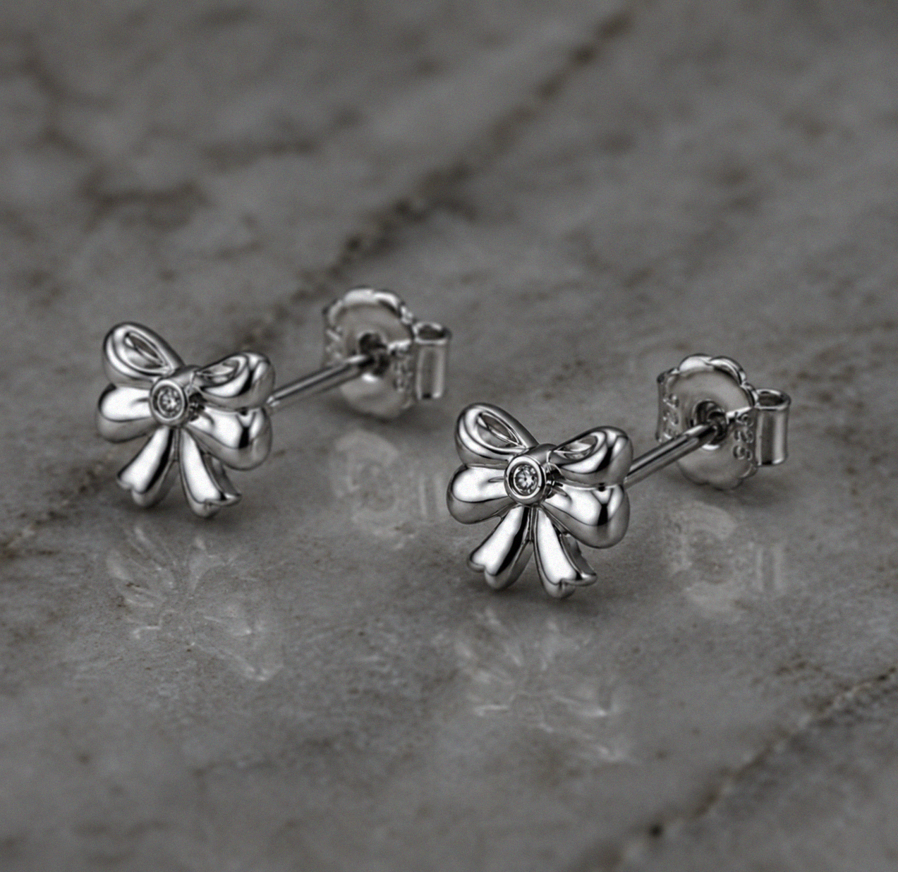 Diamond Bow Stud Earrings in Sterling Silver