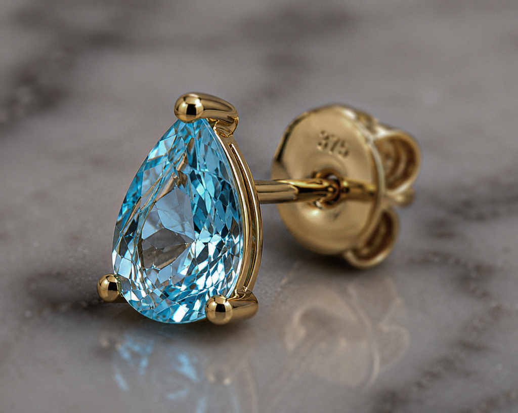 9ct Yellow Gold Pear Cut Blue Topaz Stud Earrings