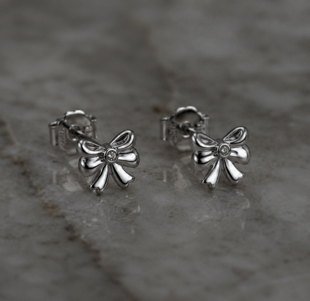 Diamond Bow Stud Earrings in Sterling Silver