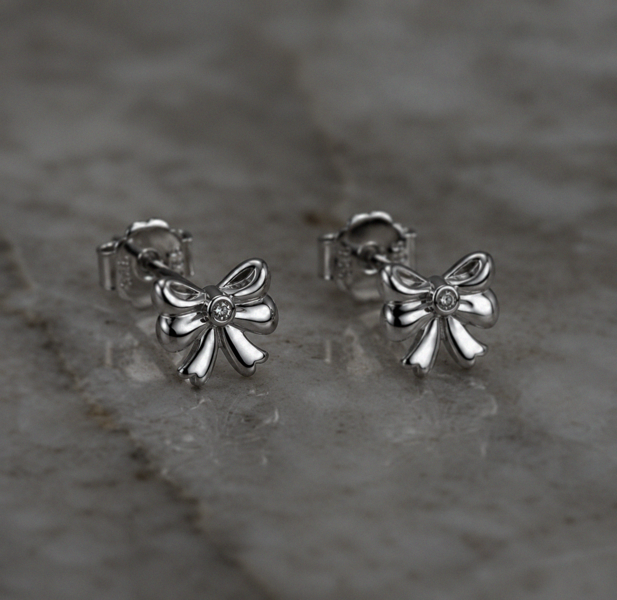 Diamond Bow Stud Earrings in Sterling Silver