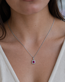 Cushion Cut Ruby & Diamond Halo Pendant Necklace in 9ct White Gold