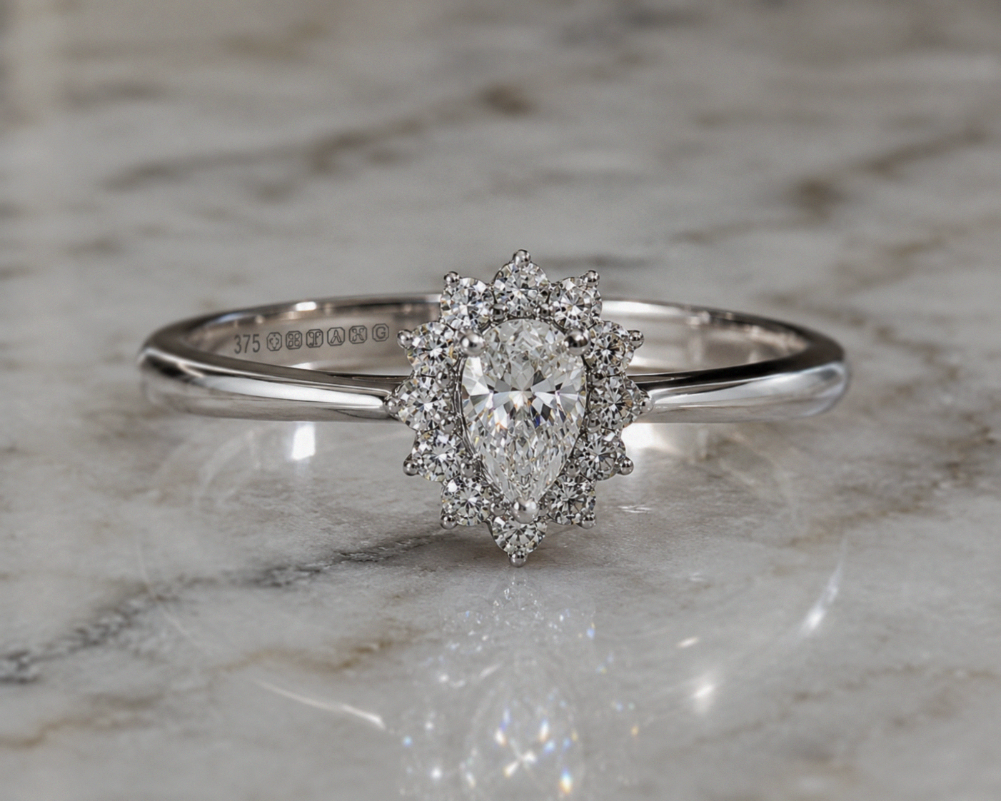 9ct White Gold 0.35ct Pear-Cut Flower Halo Diamond Engagement Ring