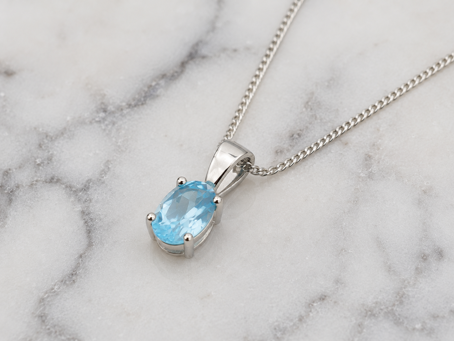9ct White Gold Swiss Blue Topaz Oval Pendant Necklace