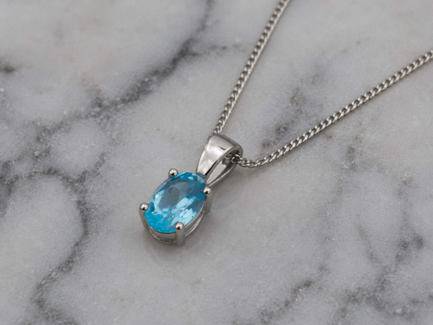 9ct White Gold Swiss Blue Topaz Oval Pendant Necklace