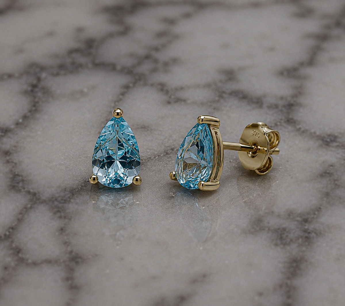 9ct Yellow Gold Pear Cut Blue Topaz Stud Earrings
