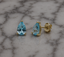 9ct Yellow Gold Pear Cut Blue Topaz Stud Earrings