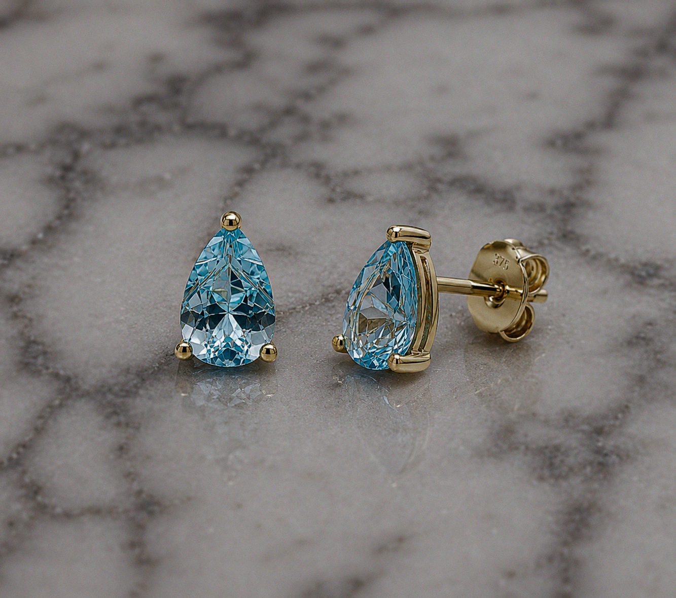 9ct Yellow Gold Pear Cut Blue Topaz Stud Earrings