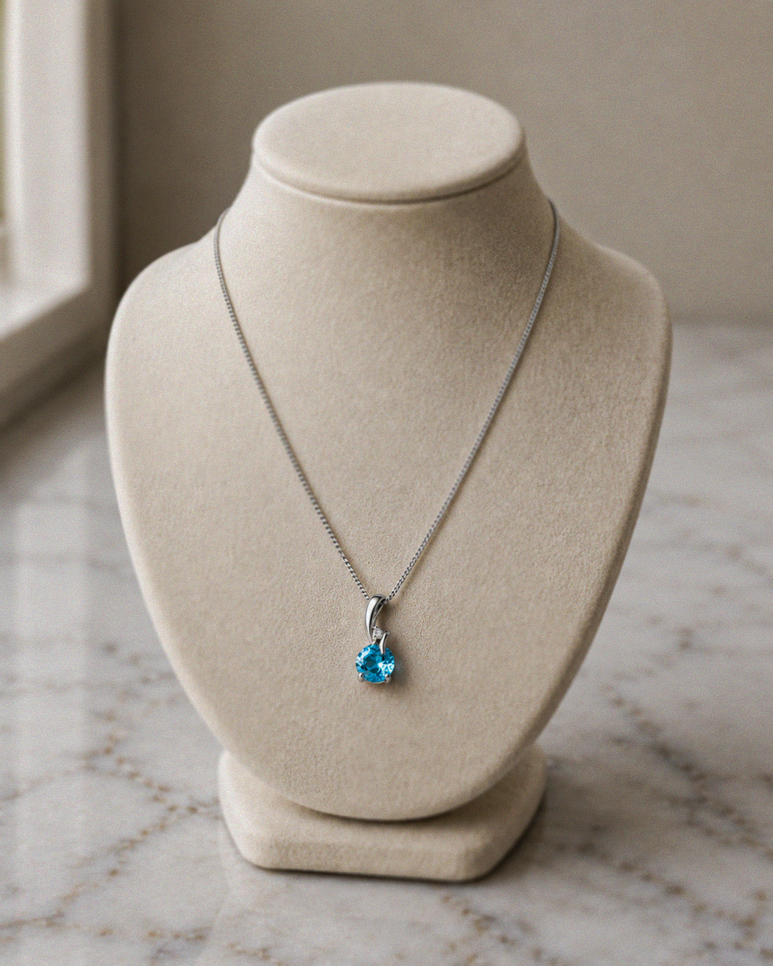 Blue Topaz & Diamond Twist Pendant on 9ct Gold