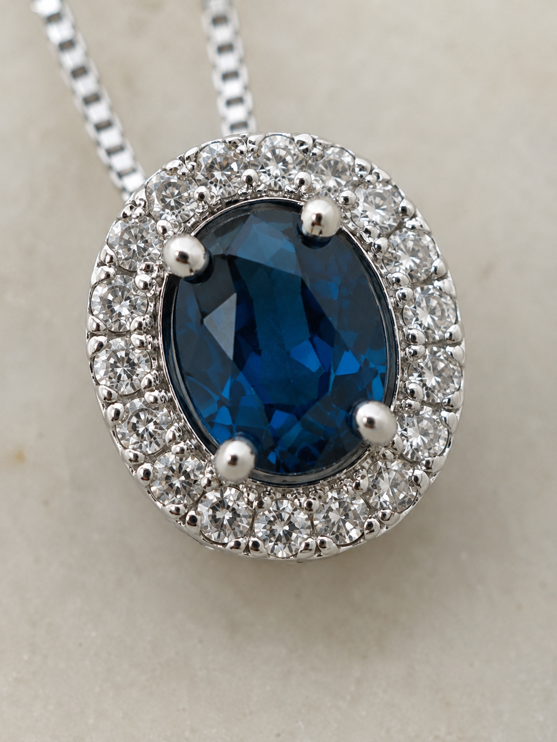 Blue Sapphire & Diamond Cluster Pendant in 9ct White Gold
