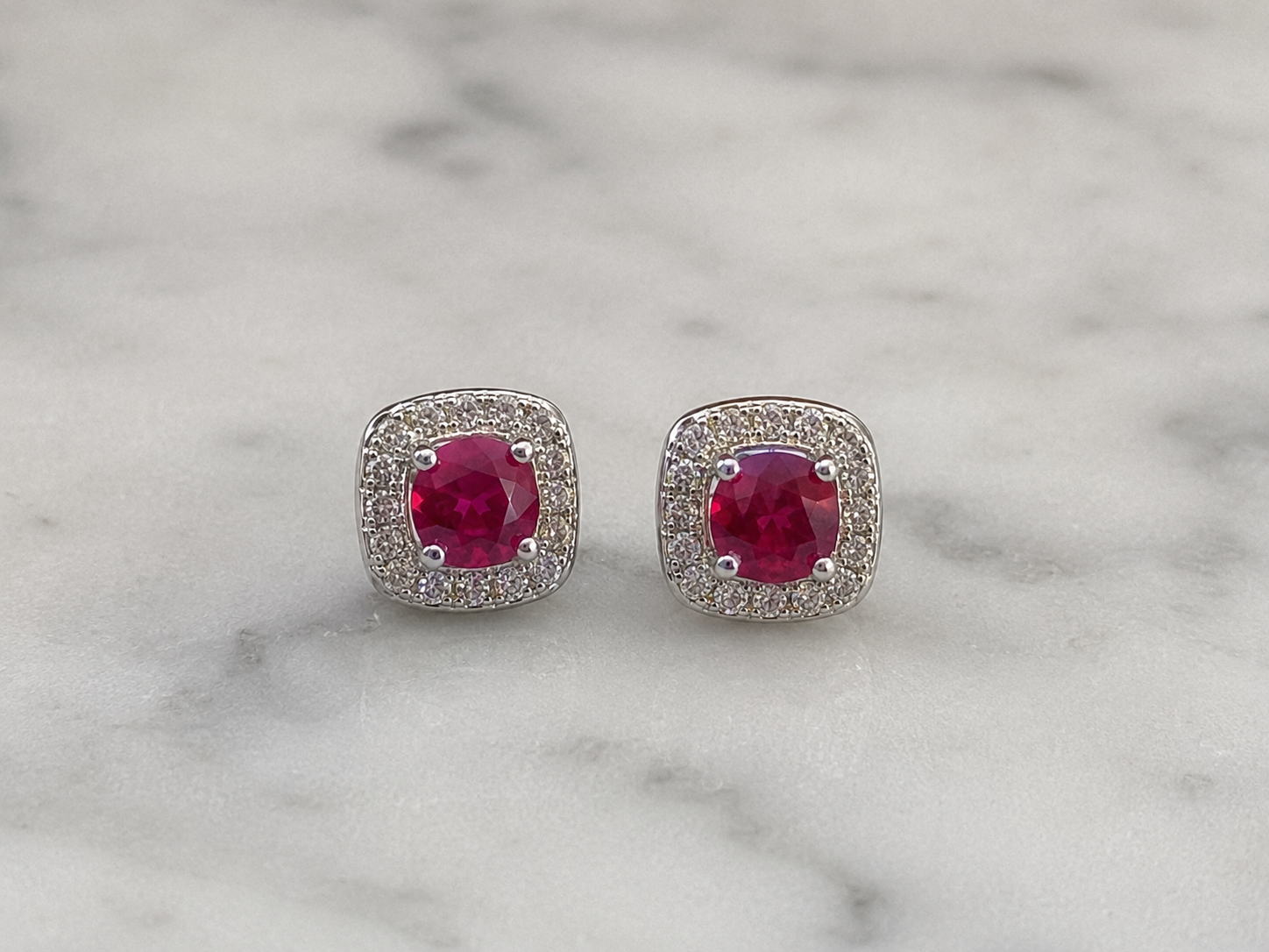 Cushion Cut Ruby & Diamond Halo Stud Earrings in 9ct White Gold