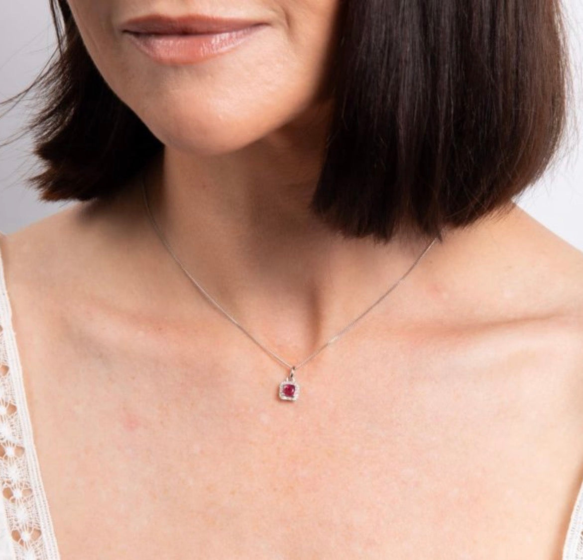 Cushion Cut Ruby & Diamond Halo Pendant Necklace in 9ct White Gold