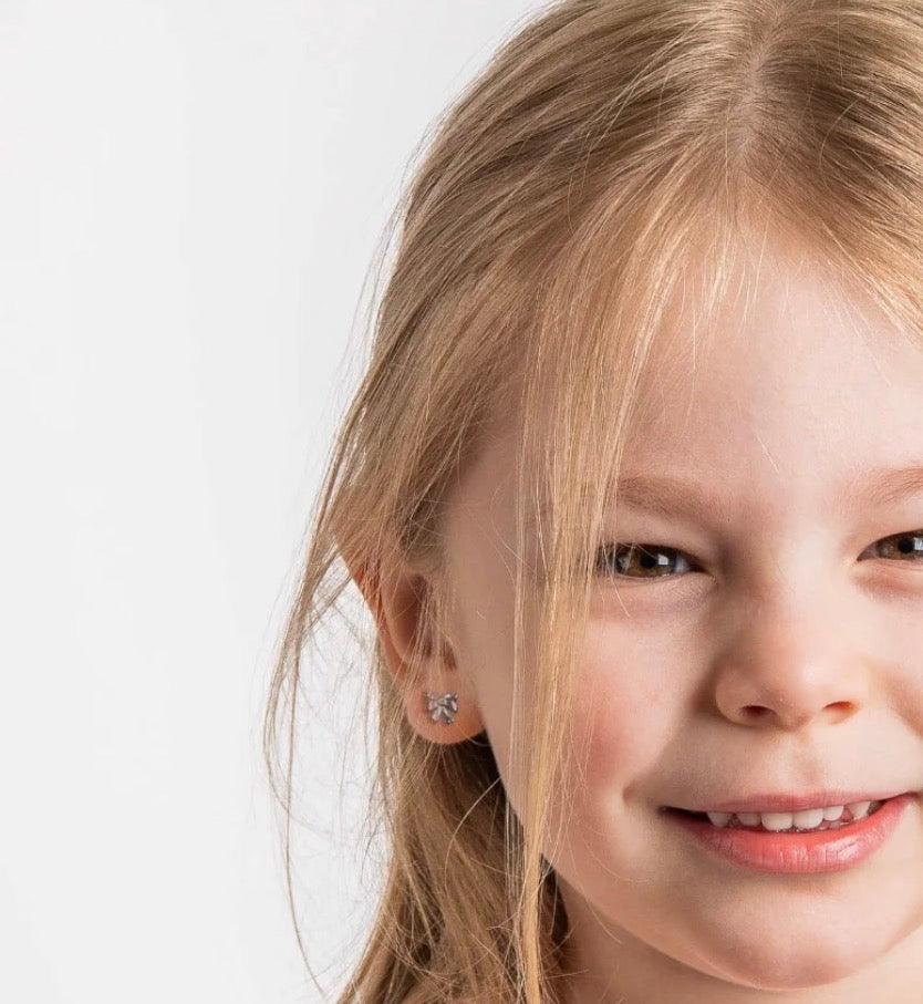 Diamond Bow Stud Earrings in Sterling Silver