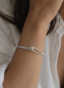 Sterling Silver Oval Bangle with Feature Ball Clasp