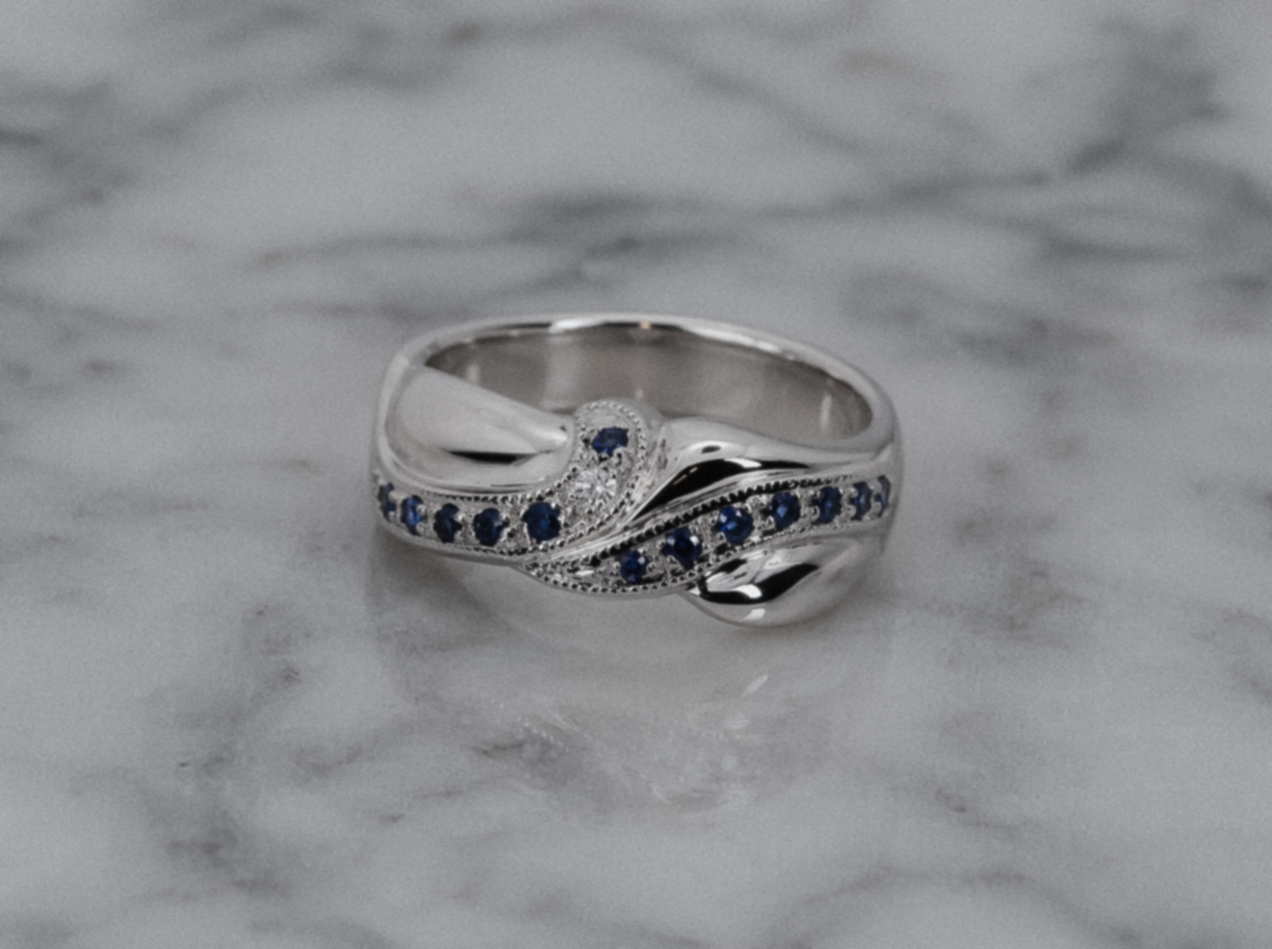 9ct White Gold Blue Sapphire & Diamond Twist Eternity Ring