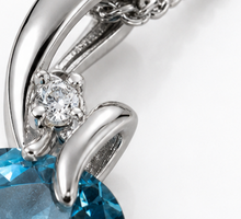 Blue Topaz & Diamond Twist Pendant on 9ct Gold