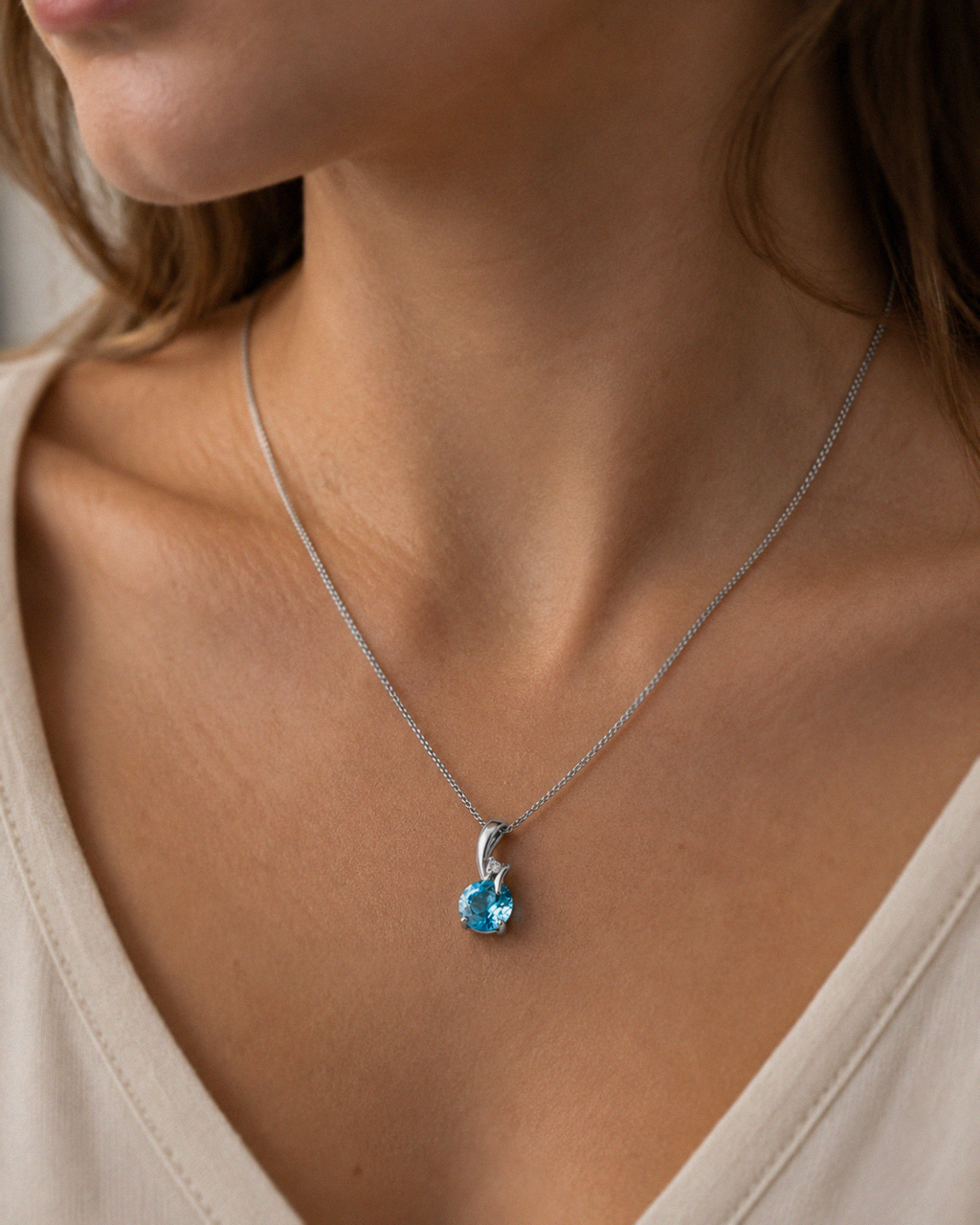 Blue Topaz & Diamond Twist Pendant on 9ct Gold