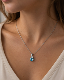 Blue Topaz & Diamond Twist Pendant on 9ct Gold