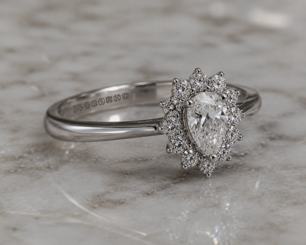 9ct White Gold 0.35ct Pear-Cut Flower Halo Diamond Engagement Ring