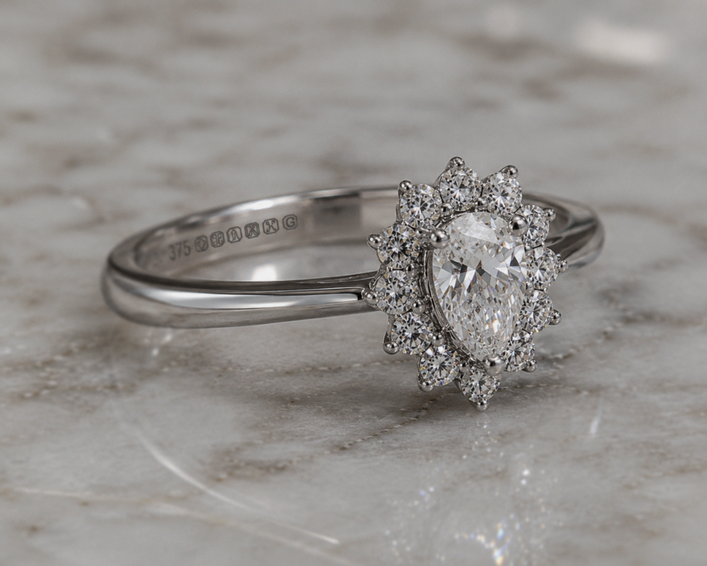 9ct White Gold 0.35ct Pear-Cut Flower Halo Diamond Engagement Ring
