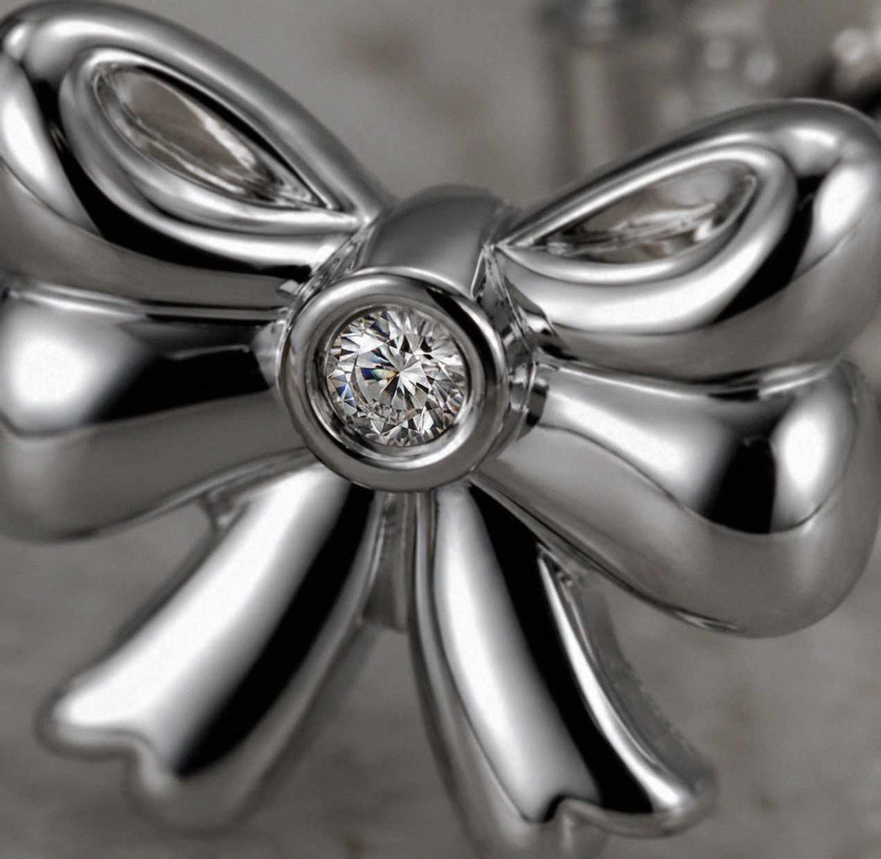 Diamond Bow Stud Earrings in Sterling Silver