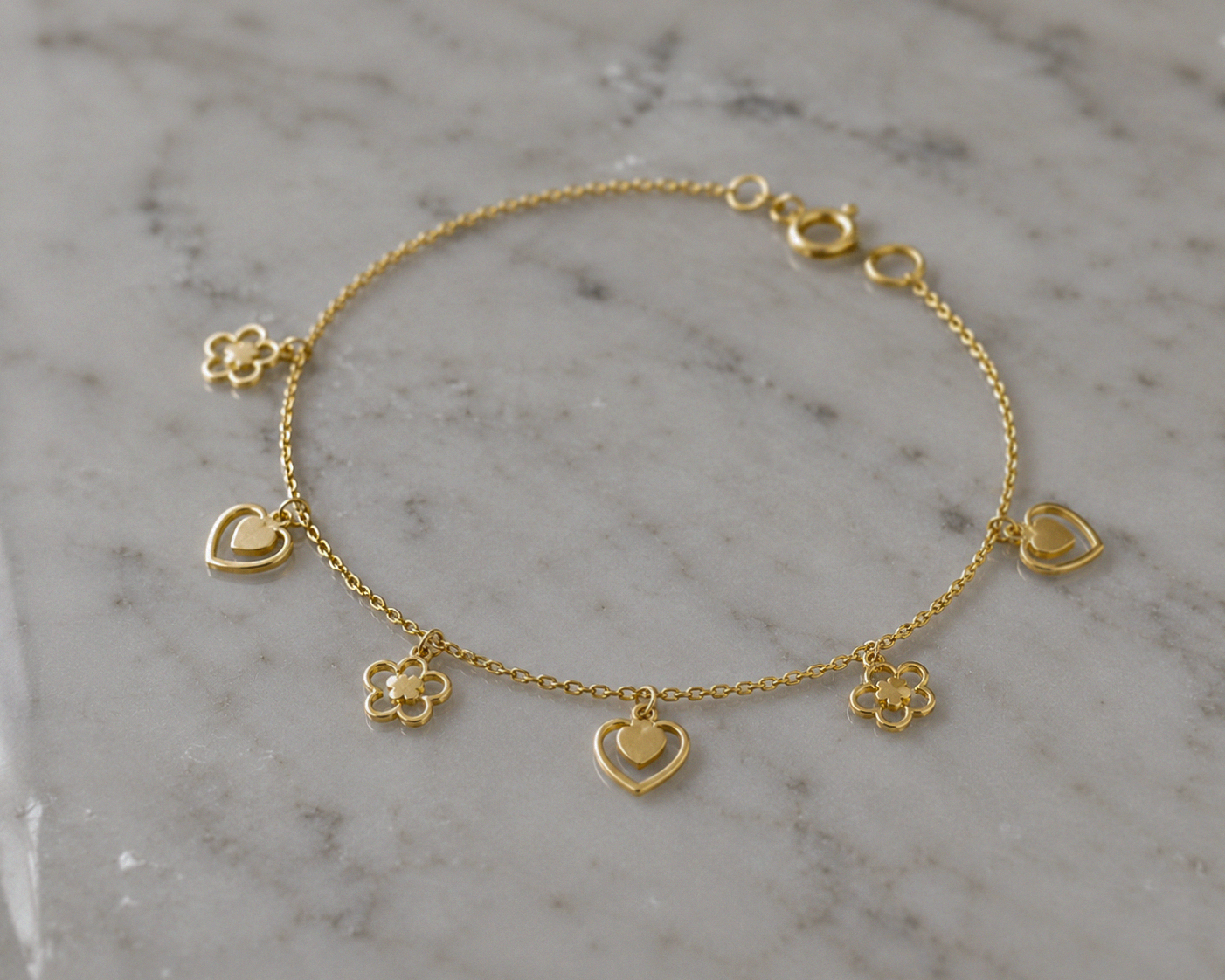 9ct Gold Heart & Flower Charm Bracelet - Delicate Charm Bracelet in Yellow Gold.