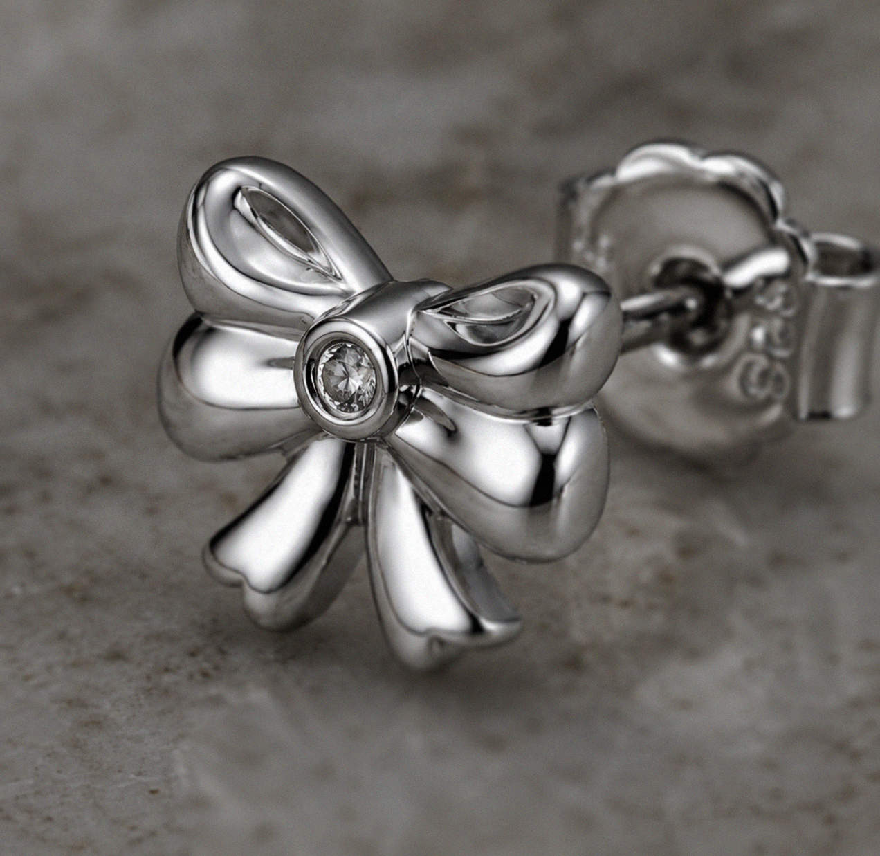 Diamond Bow Stud Earrings in Sterling Silver