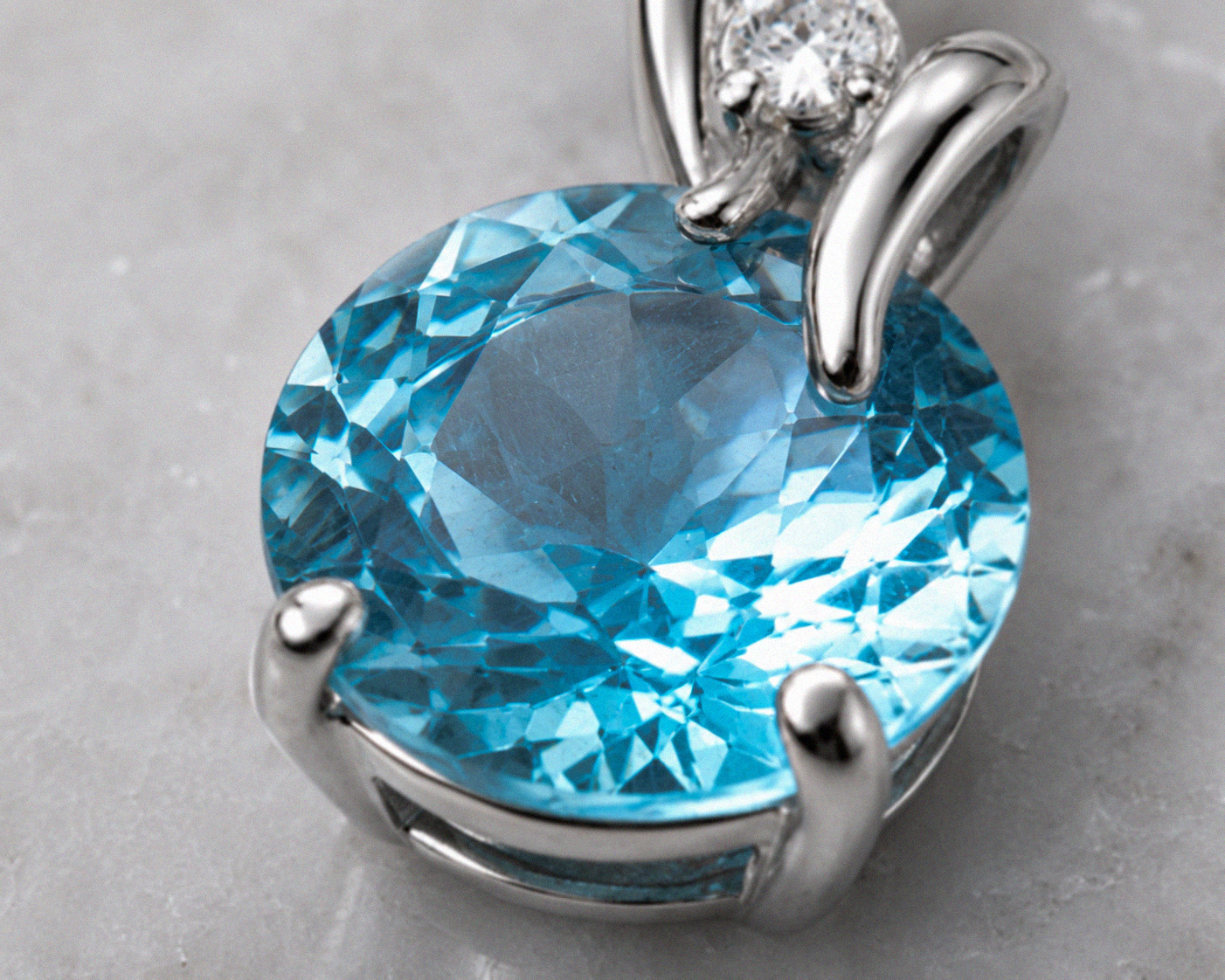 Blue Topaz & Diamond Twist Pendant on 9ct Gold