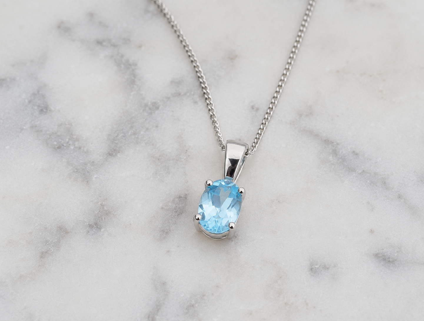 9ct White Gold Swiss Blue Topaz Oval Pendant Necklace