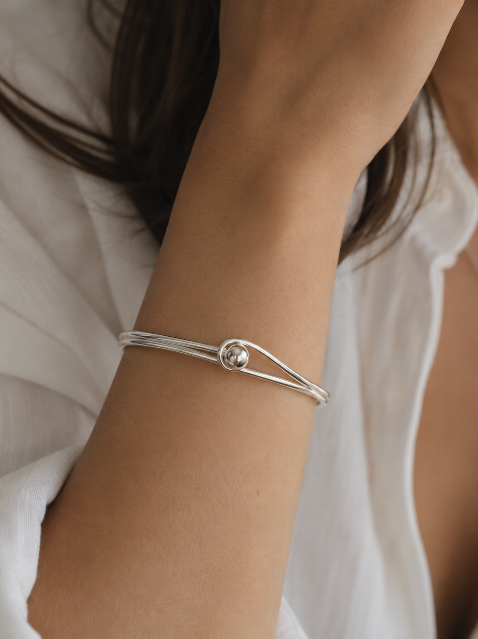 Sterling Silver Oval Bangle with Feature Ball Clasp Sterling Silver Oval Bangle with Feature Ball Clasp