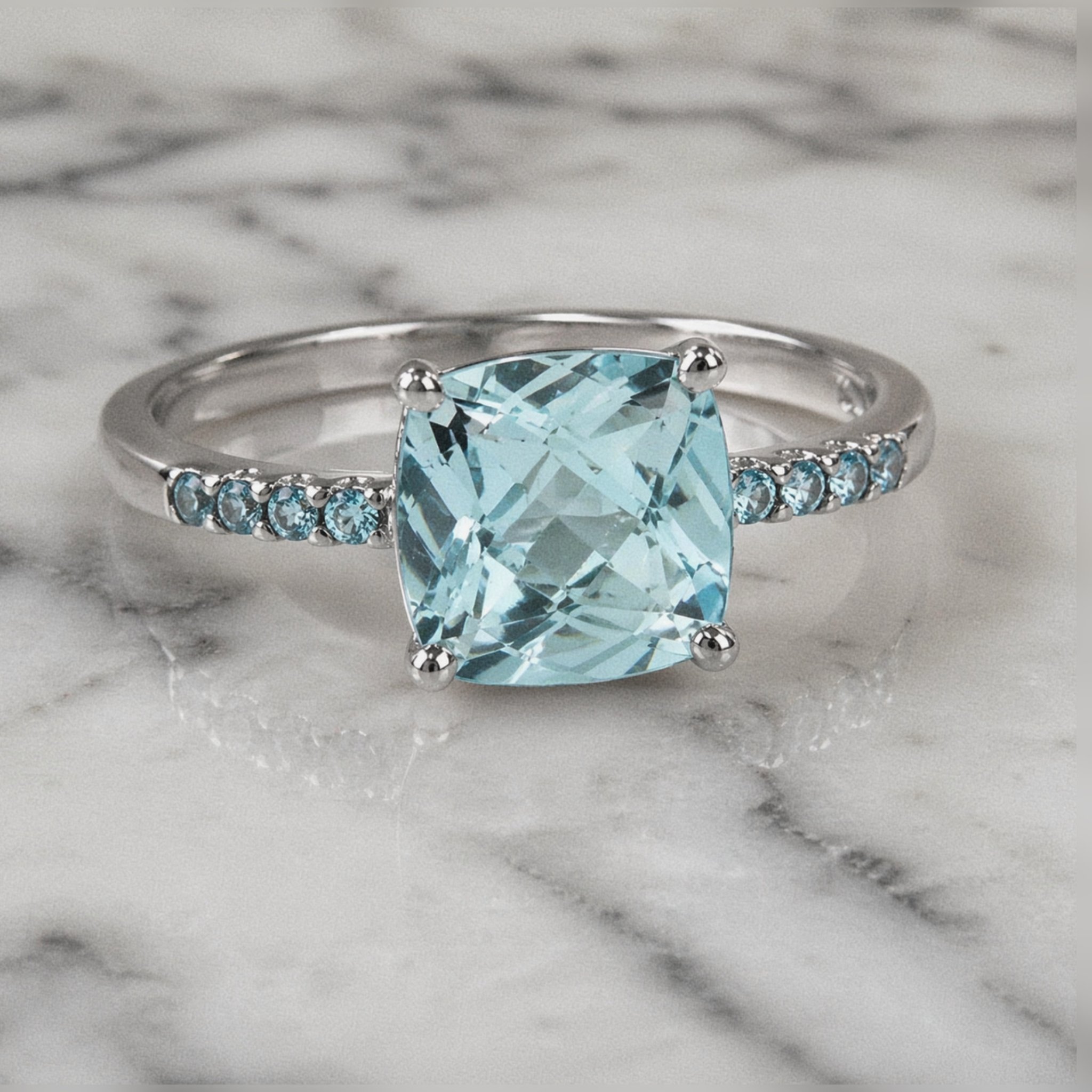 9ct White Gold Sky Blue Topaz Solitaire Ring with Blue Topaz Shoulder
