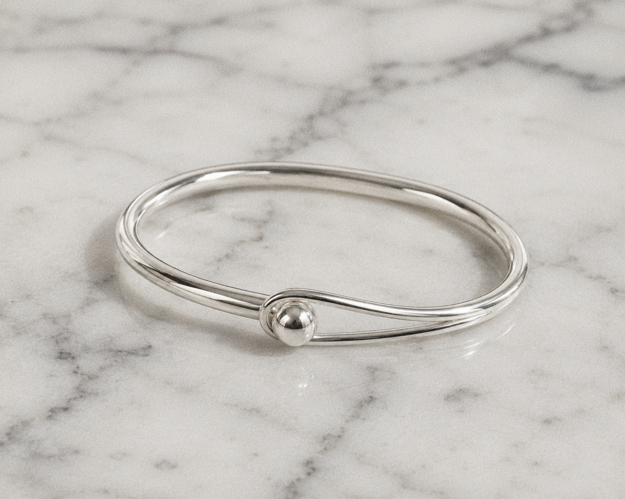 Sterling Silver Oval Bangle with Feature Ball Clasp Sterling Silver Oval Bangle with Feature Ball Clasp